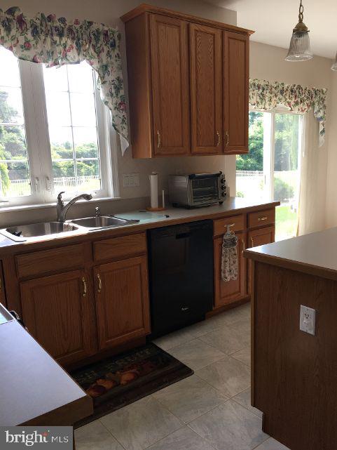 42 Hill Road Warminster, PA 18974 - Photo 16 of 44 a kitchen with a sink a stove a window and cabinets