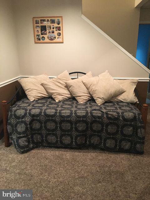 42 Hill Road Warminster, PA 18974 - Photo 34 of 44 a bed sitting in a bedroom next to a lamp