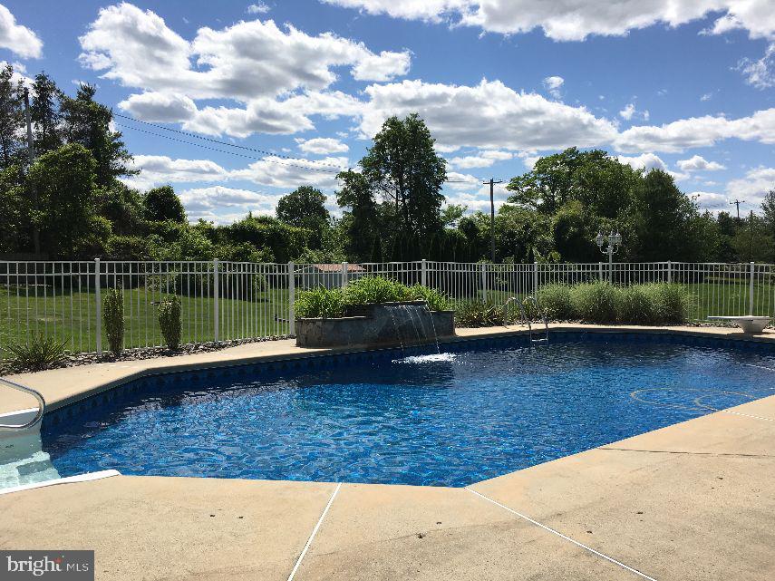 42 Hill Road Warminster, PA 18974 - Photo 9 of 44 a view of a lake with a sitting space