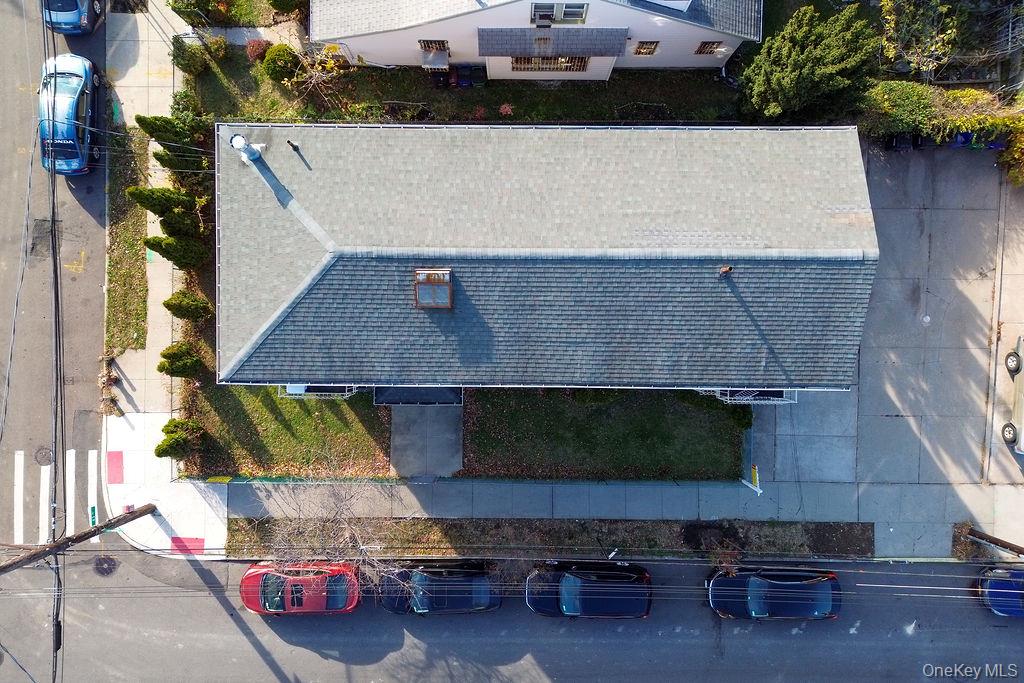 62-66 102nd Street Queens, NY 11374 - Photo 13 of 15 an aerial view of a house with a yard
