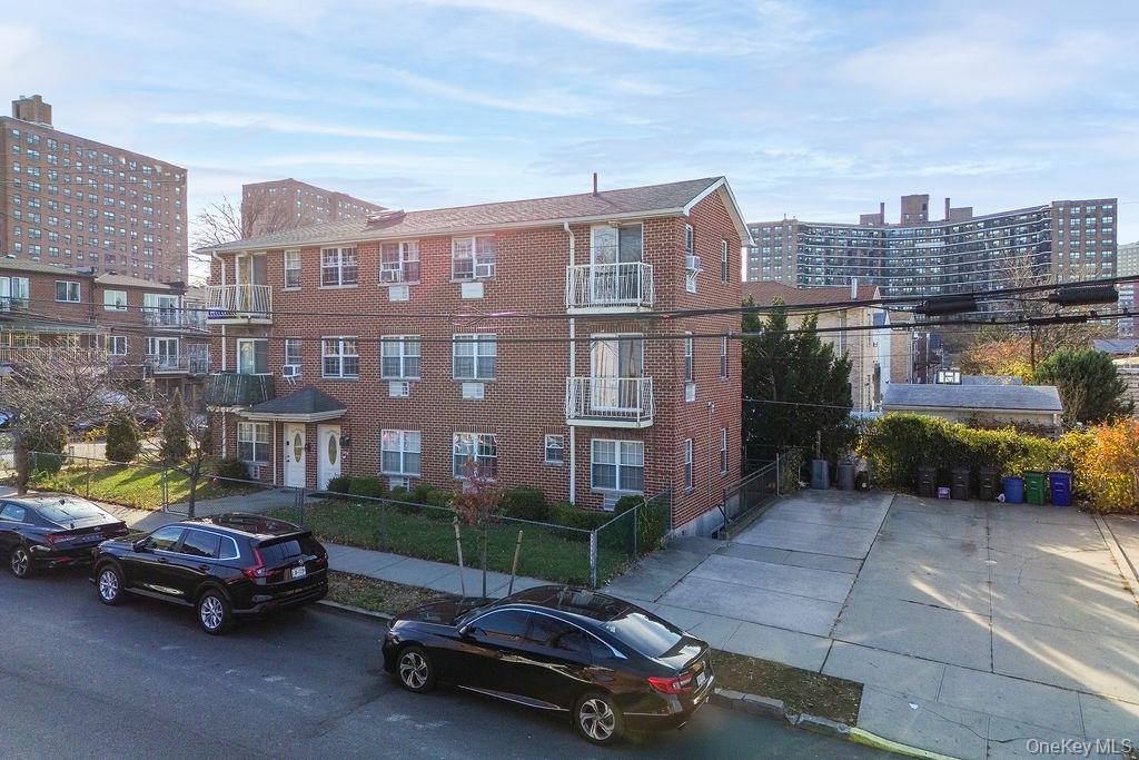 62-66 102nd Street Queens, NY 11374 - Photo 2 of 15 a car parked in front of a brick building