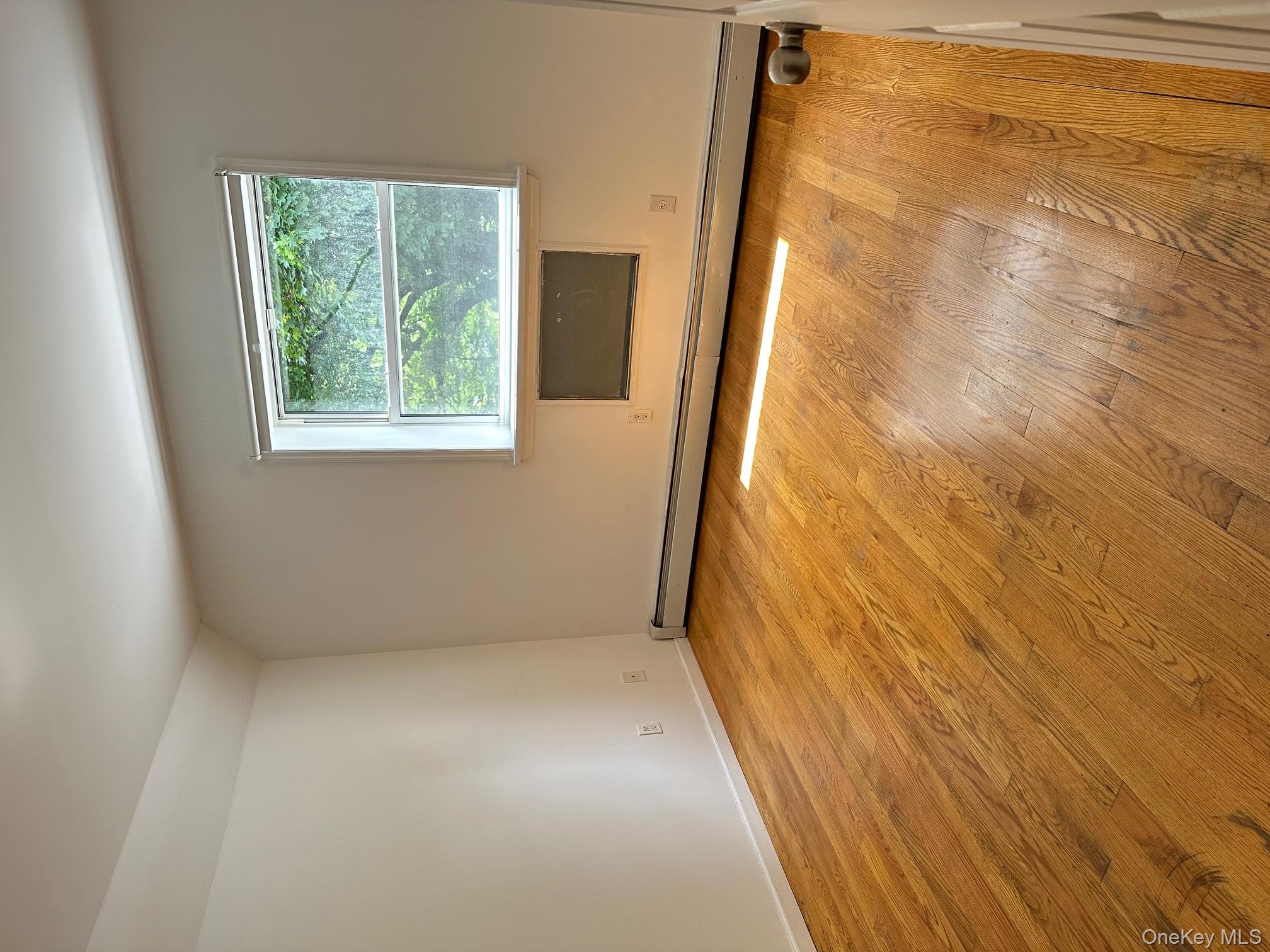 62-66 102nd Street Queens, NY 11374 - Photo 9 of 15 a view of an empty room with a window