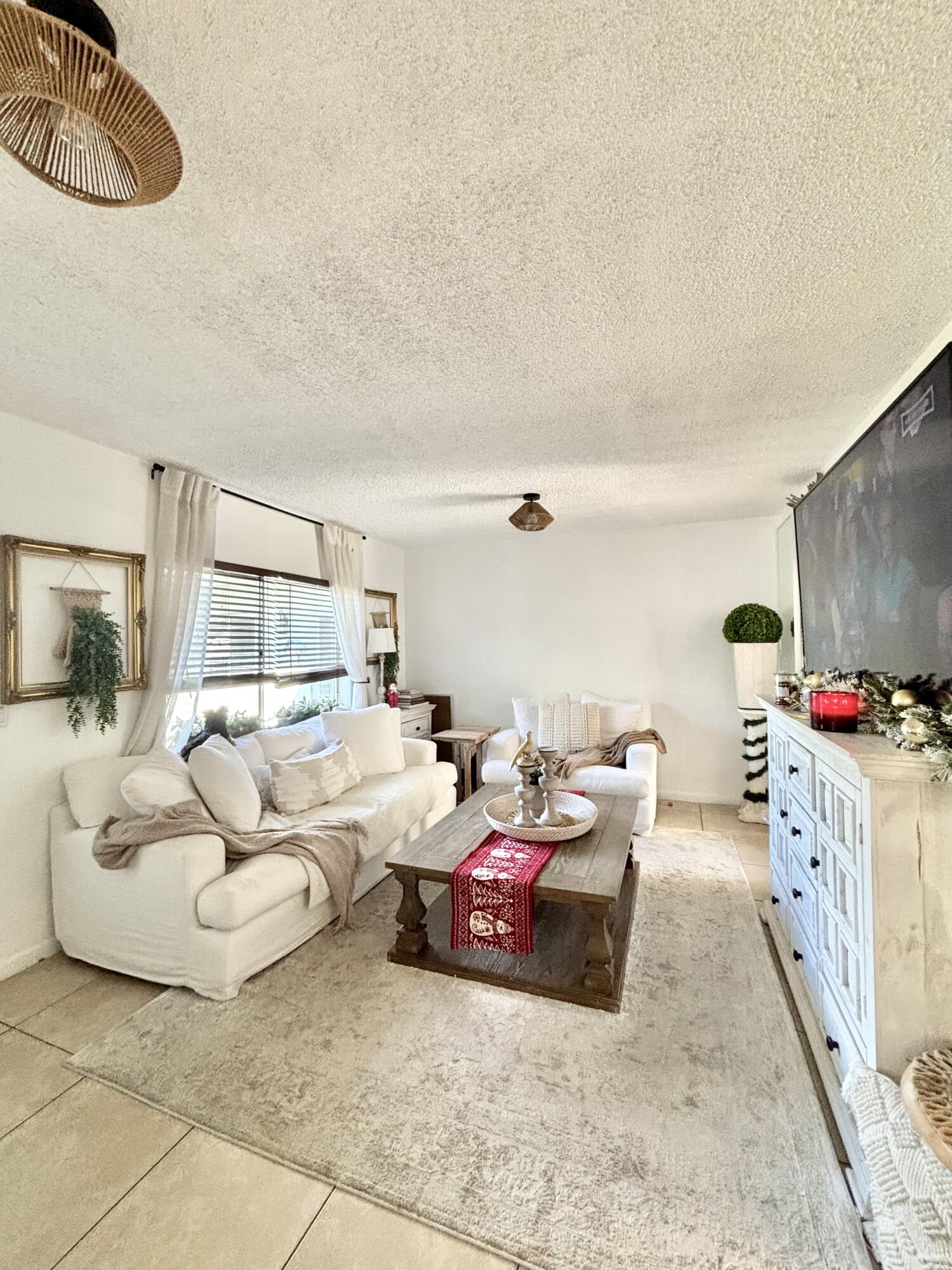 262 Southeast 9th Avenue, Unit C Deerfield Beach, FL 33441 - Photo 2 of 12 a bedroom with furniture and a couch