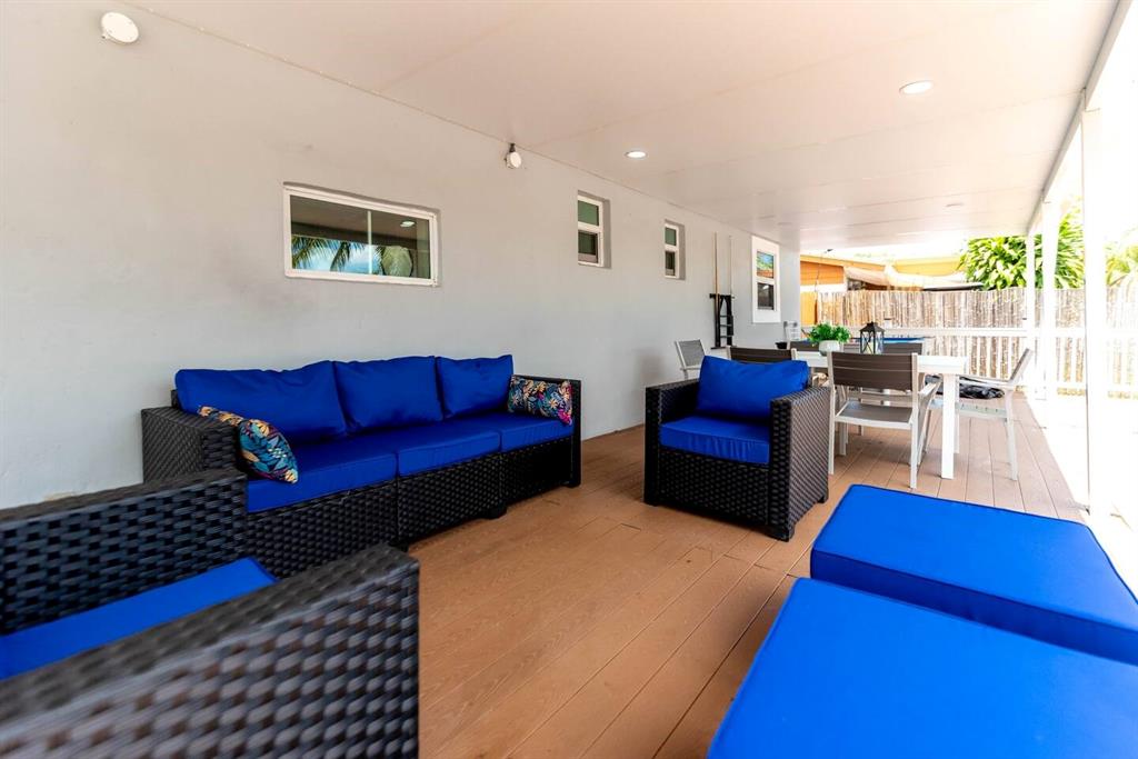 4154 Southwest 49th Street Dania Beach, FL 33314 - Photo 16 of 30 a living room with furniture and a rug