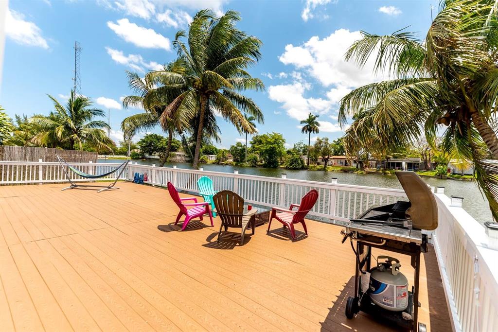 4154 Southwest 49th Street Dania Beach, FL 33314 - Photo 17 of 30 a view of outdoor space with swimming pool and patio