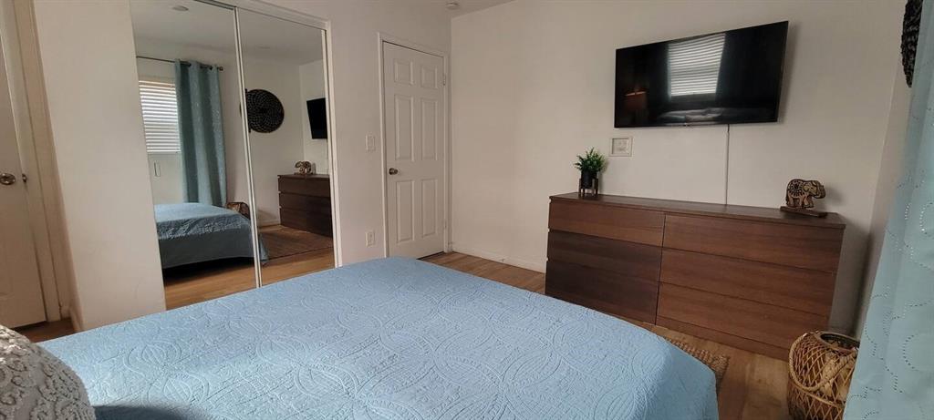 4154 Southwest 49th Street Dania Beach, FL 33314 - Photo 30 of 30 a bedroom with a bed and a flat screen tv