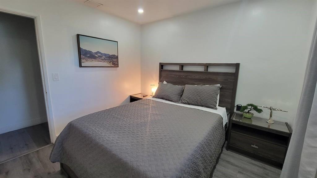 4154 Southwest 49th Street Dania Beach, FL 33314 - Photo 8 of 30 a bedroom with a bed and painting on the wall