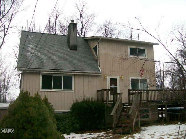 a front view of a house with parking area