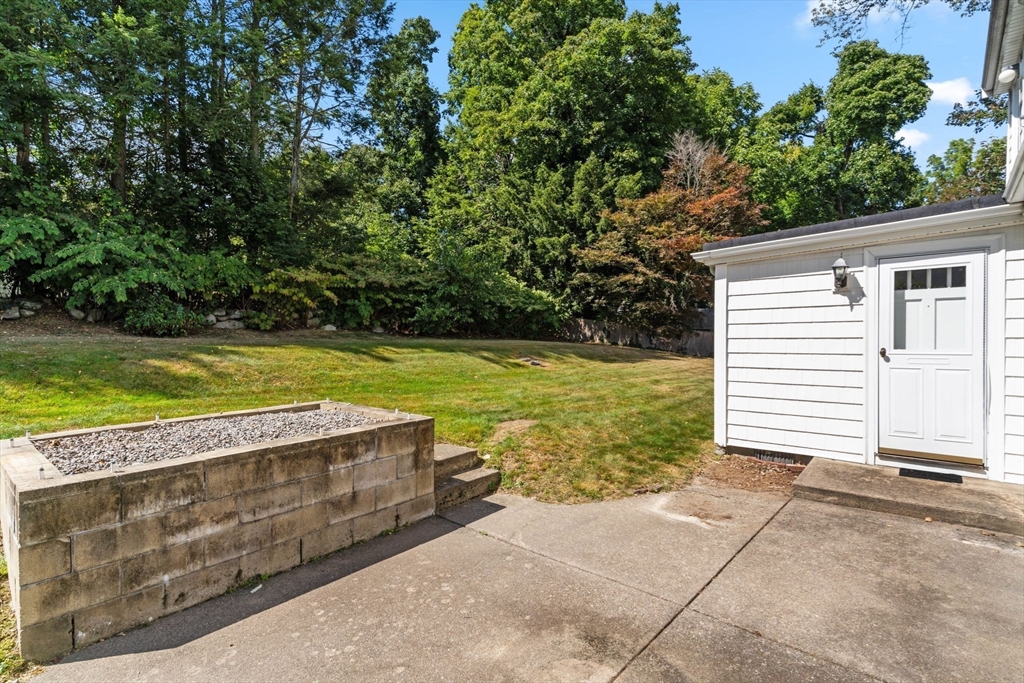 25 Centre Lane Milton, MA 02186 - Photo 13 of 32 a view of a swimming pool with an outdoor space and seating area