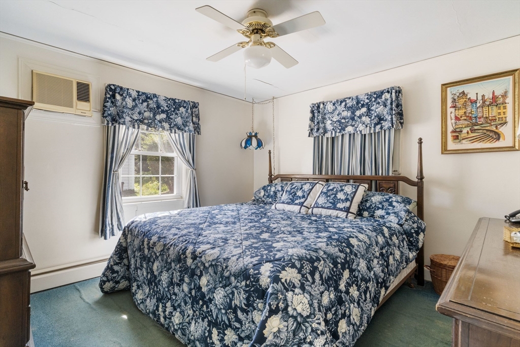 25 Centre Lane Milton, MA 02186 - Photo 14 of 32 a bedroom with a bed and a window