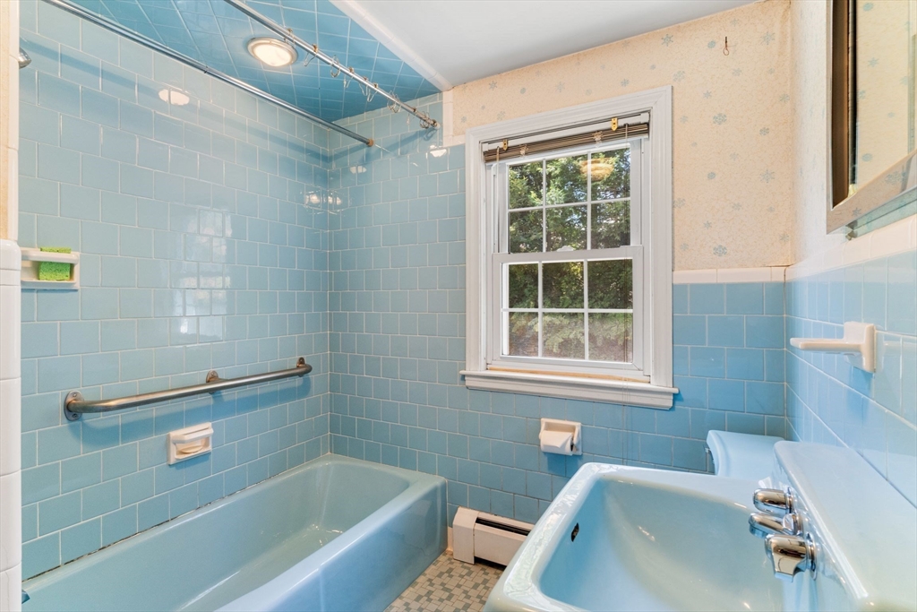 25 Centre Lane Milton, MA 02186 - Photo 21 of 32 a bathroom with a tub a sink and a window