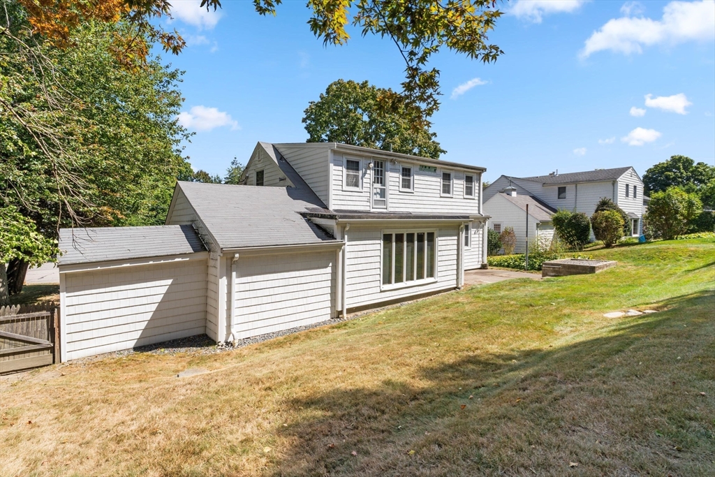 25 Centre Lane Milton, MA 02186 - Photo 26 of 32 a front view of a house with a yard