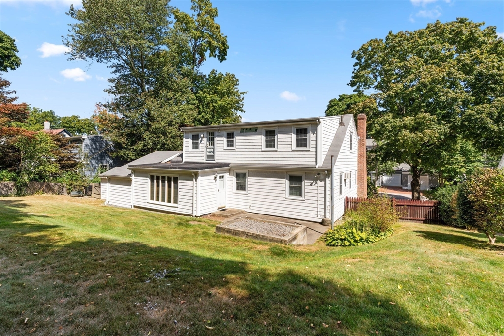 25 Centre Lane Milton, MA 02186 - Photo 28 of 32 a view of a house with a big yard and large tree