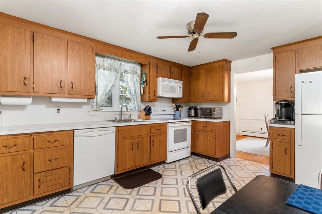 25 Centre Lane Milton, MA 02186 - Photo 9 of 32 a kitchen with sink cabinets and window