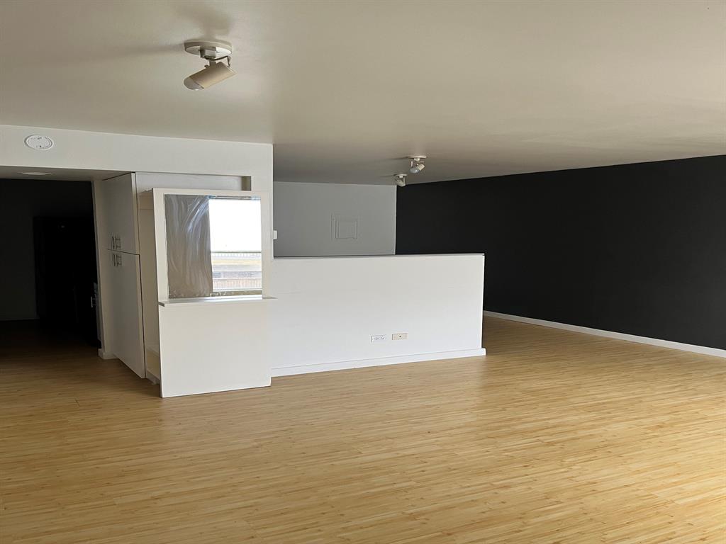 4343 Travis Street, Unit 10 Dallas, TX 75205 - Photo 4 of 10 a view of empty room with wooden floor