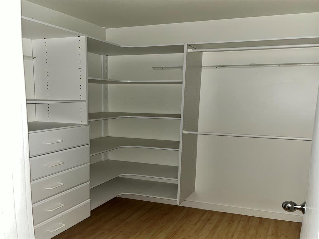 4343 Travis Street, Unit 10 Dallas, TX 75205 - Photo 8 of 10 a view of walk in closet with empty racks