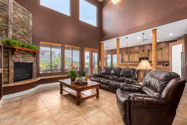 a view of a dining room with furniture wooden floor and chandelier