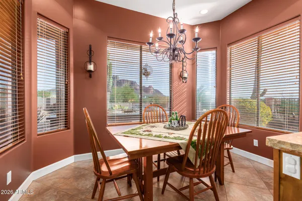 a large kitchen with stainless steel appliances a refrigerator and a stove