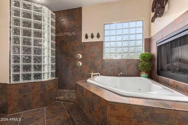 a view of a room with wooden floor and white walls