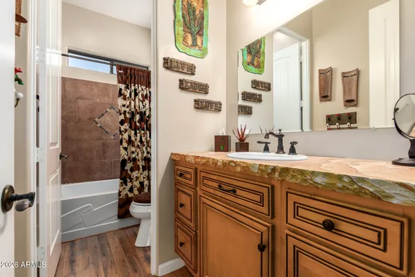 a view of hallway with wooden floor