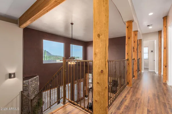 a room with furniture pool table flat screen tv and a large window