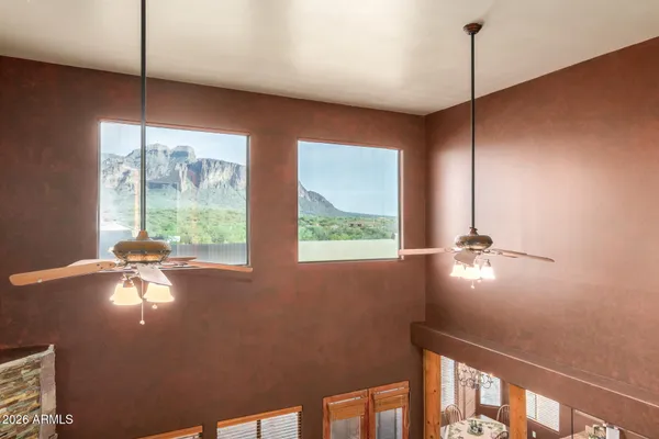 a work room with furniture and a potted plant