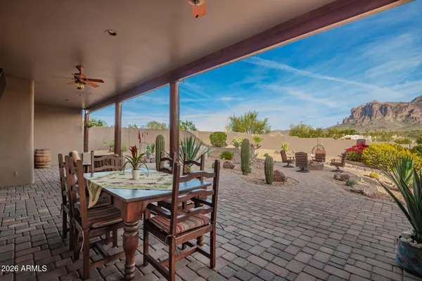 a view of a backyard with furniture