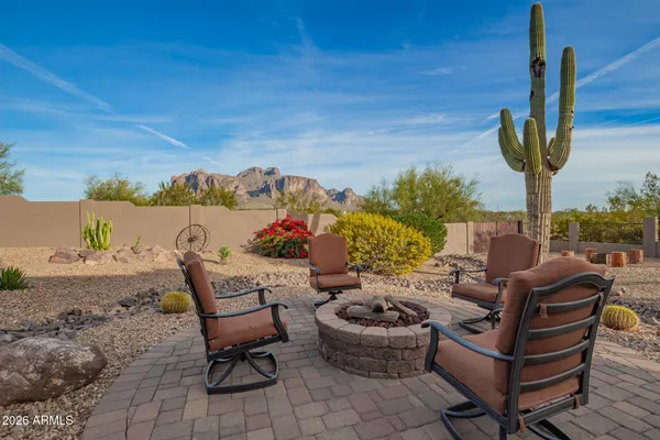 a view of a house with backyard porch and sitting area