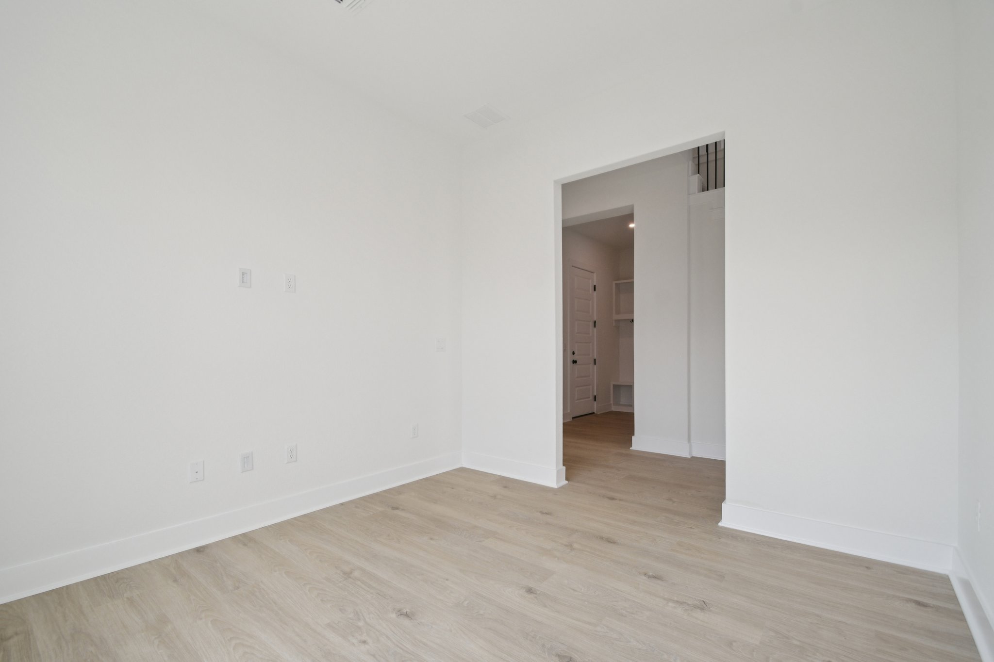 1660 Cardinal Lane Round Rock, TX 78681 - Photo 18 of 35 a view of an empty room with wooden floor and closet