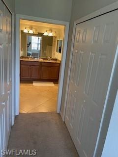 3149 Aviamar Circle, Unit 101 Naples, FL 34114 - Photo 16 of 20 a view of a bathroom from a window