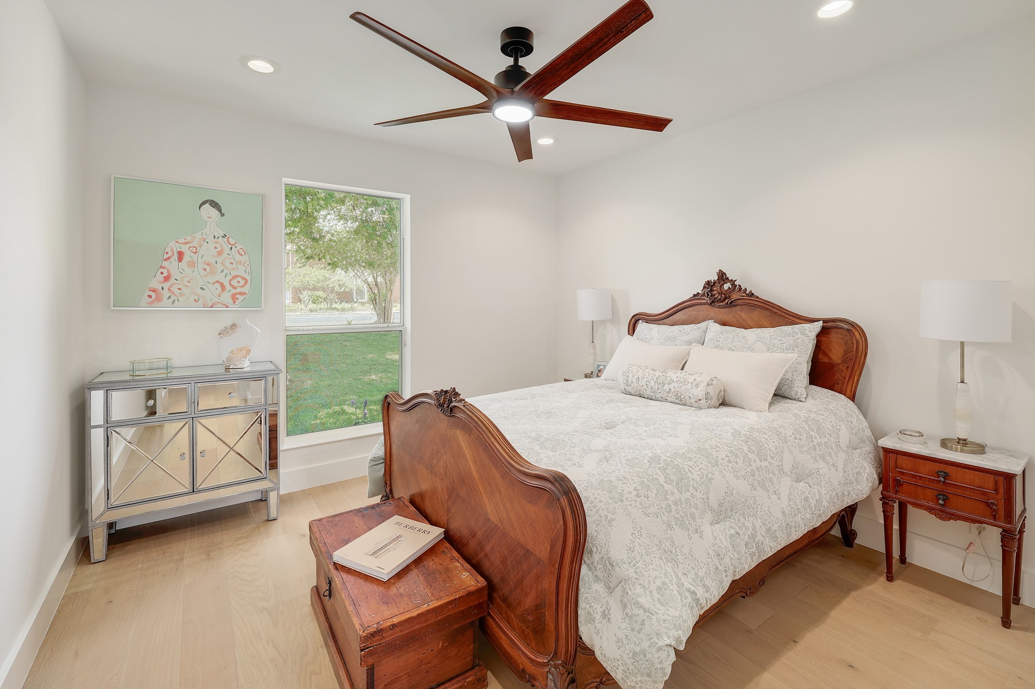 7705 Jester Boulevard Austin, TX 78730 - Photo 19 of 36 A tranquil bedroom retreat features a ceiling fan, recessed lighting, and elegant hardwood flooring.