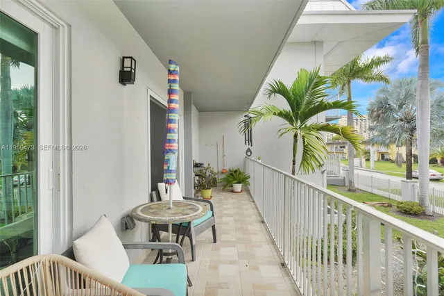 a view of a balcony with furniture