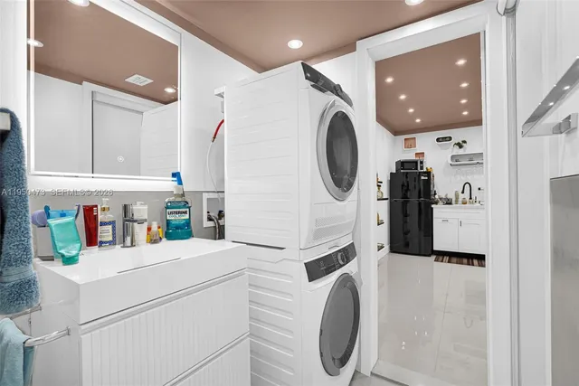 a kitchen with a refrigerator and washer