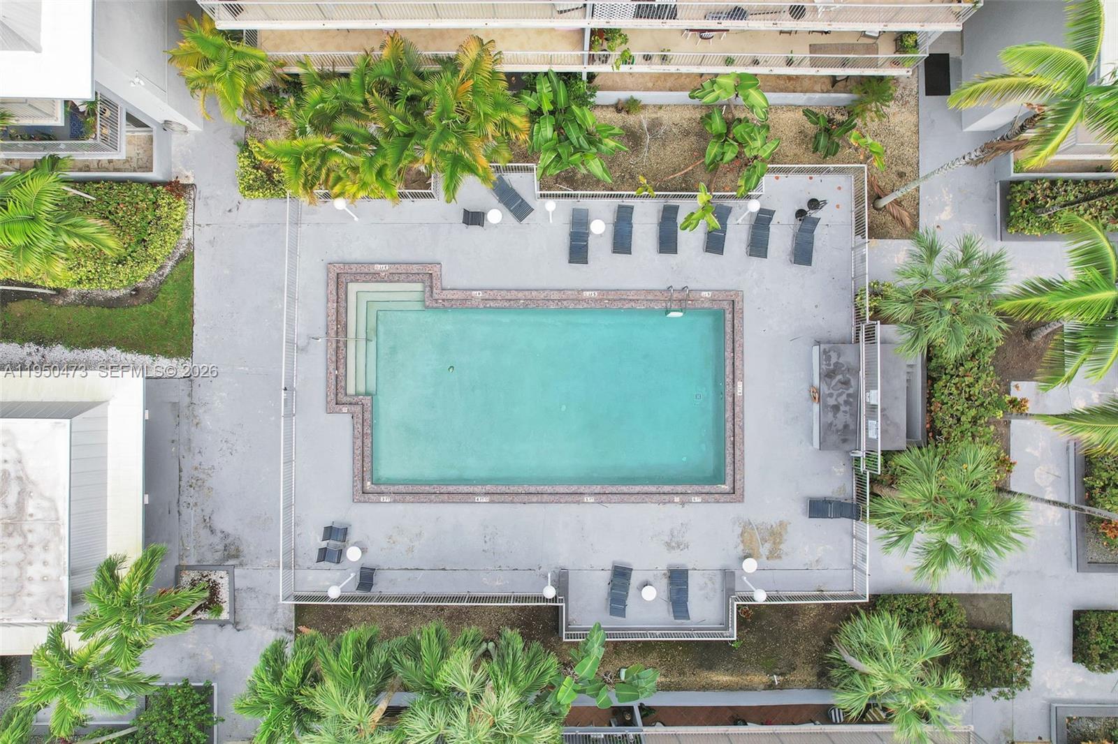 7401 Southwest 82nd Street, Unit 202S Miami, FL 33143 - Photo 22 of 39 a front view of a house with a garden