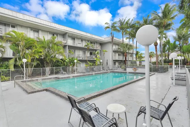 a view of a swimming pool with a lounge chairs