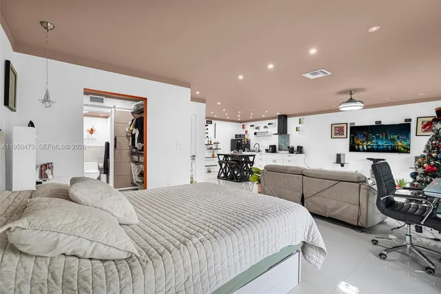 a bedroom with a bed and furniture