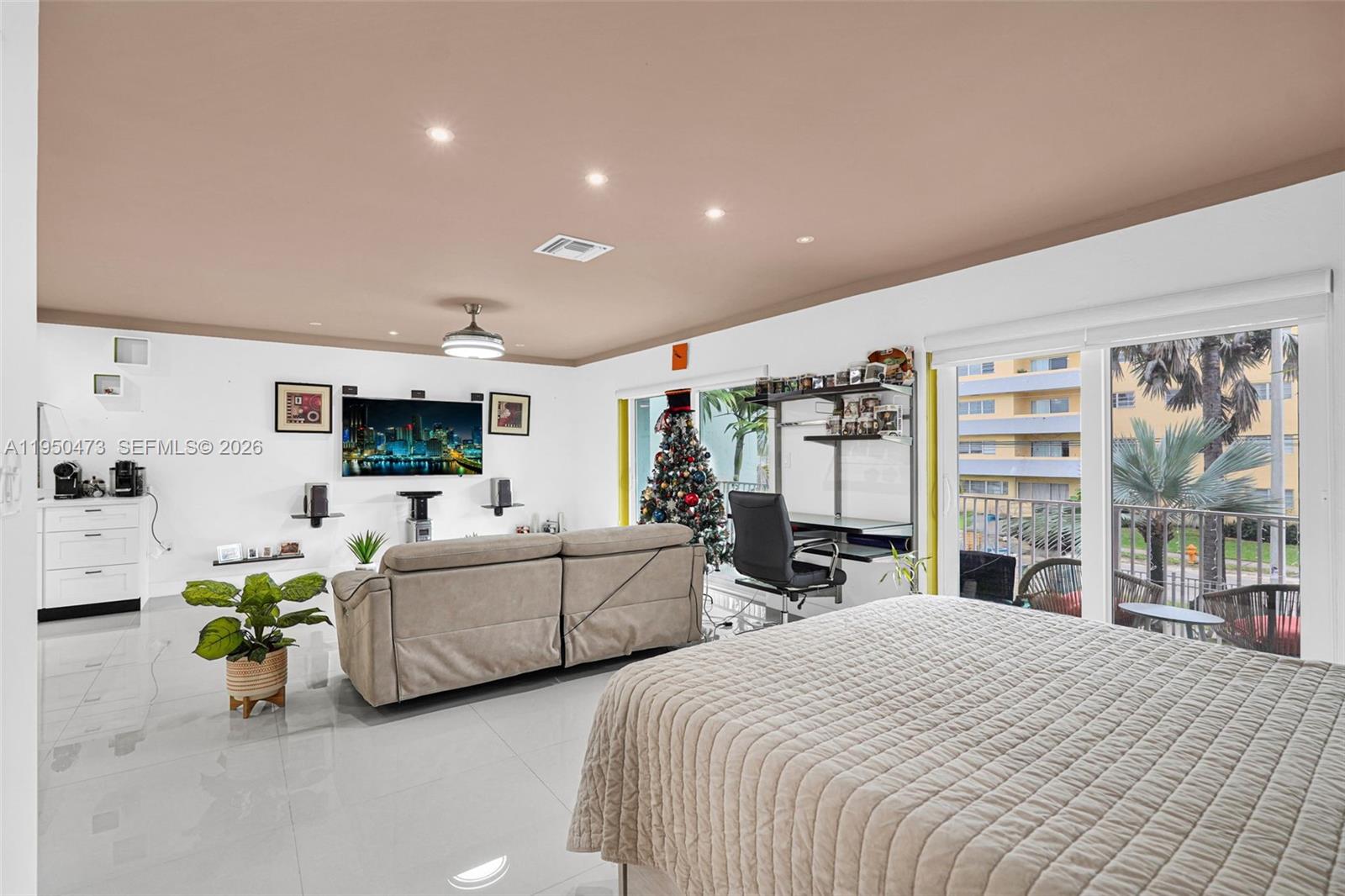 7401 Southwest 82nd Street, Unit 202S Miami, FL 33143 - Photo 37 of 39 a bedroom with bed and a large window