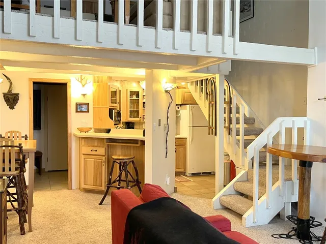 a view of a living room and entry way