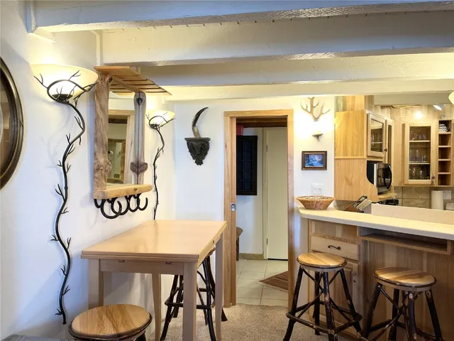 a view of a dining room with furniture and window