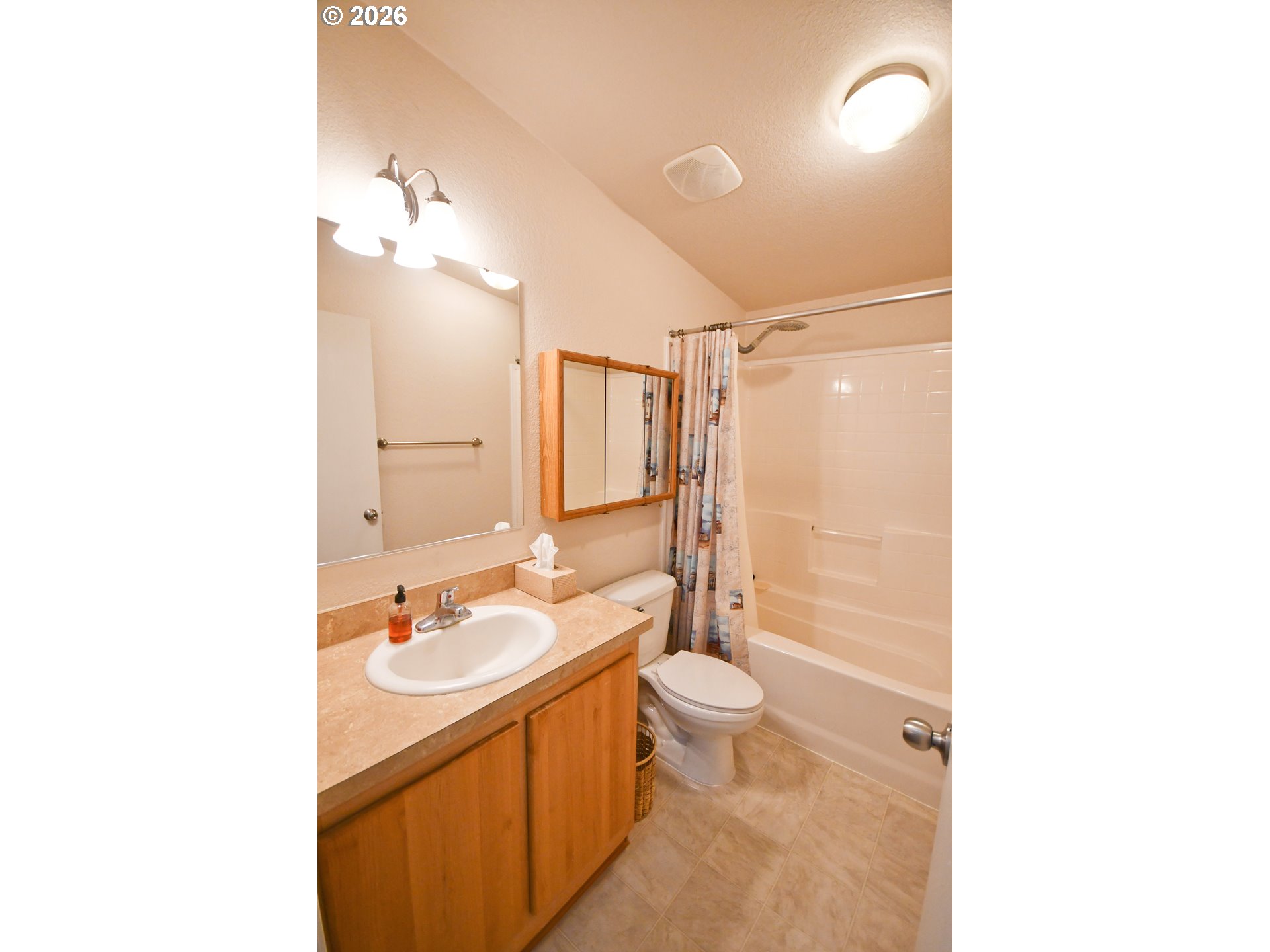 755 Division Street, Unit 322 The Dalles, OR 97058 - Photo 11 of 14 a bathroom with a sink a toilet and shower
