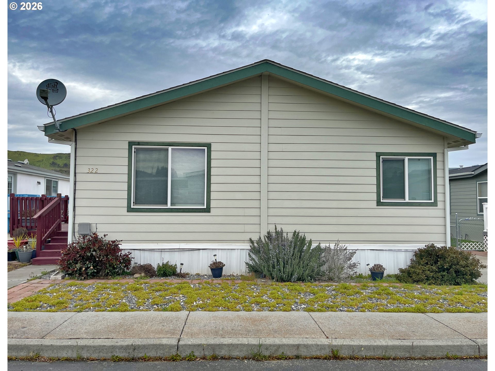 755 Division Street, Unit 322 The Dalles, OR 97058 - Photo 14 of 14 a front view of a house with garage