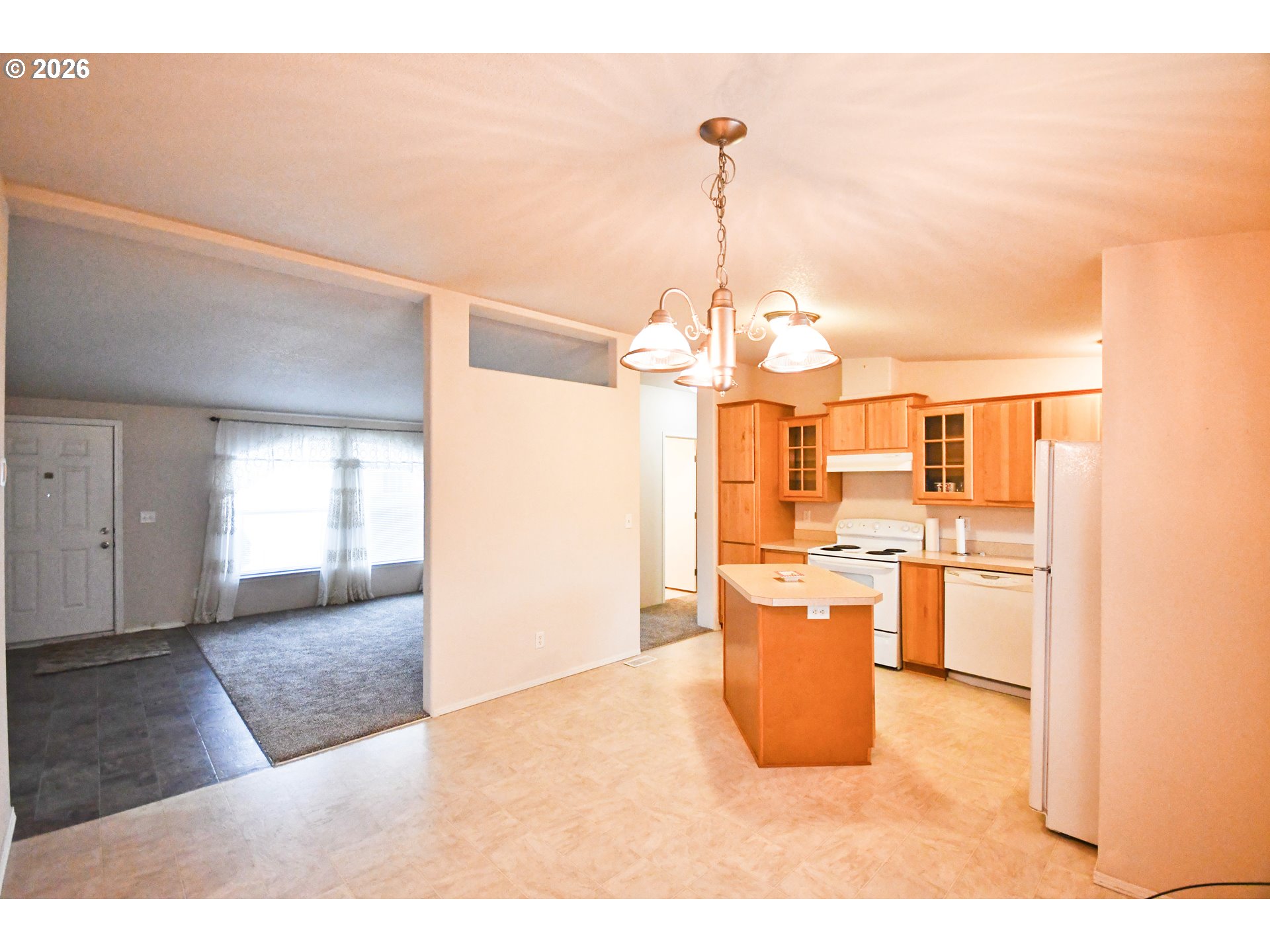 755 Division Street, Unit 322 The Dalles, OR 97058 - Photo 5 of 14 a view of a living room and kitchen