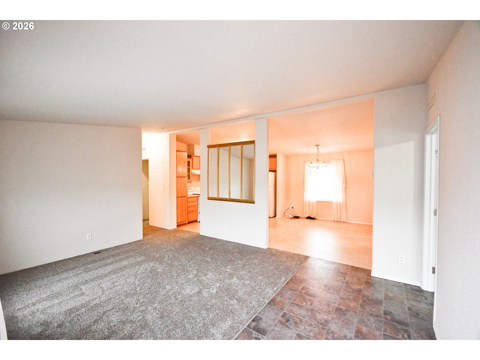 755 Division Street, Unit 322 The Dalles, OR 97058 - Photo 6 of 14 a view of an empty room with a window