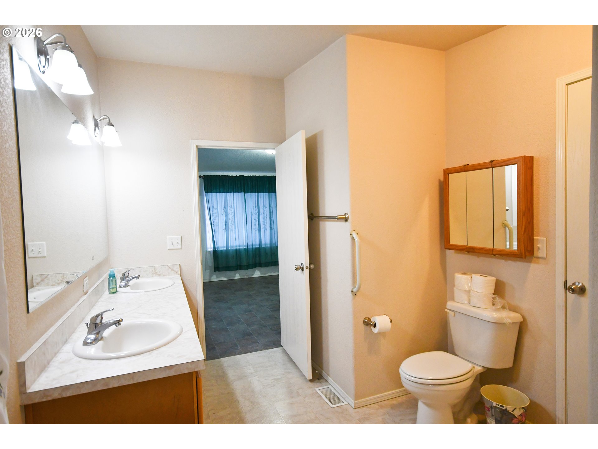 755 Division Street, Unit 322 The Dalles, OR 97058 - Photo 9 of 14 a bathroom with a sink toilet and shower