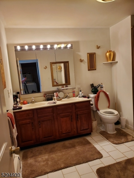 7 Martin Street Newton, NJ 07860 - Photo 12 of 16 a bathroom with a toilet sink and mirror