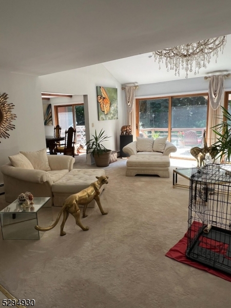 7 Martin Street Newton, NJ 07860 - Photo 16 of 16 a living room with furniture a large window and a chandelier