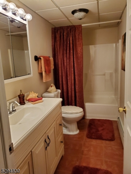 7 Martin Street Newton, NJ 07860 - Photo 5 of 16 a bathroom with a sink a toilet and shower