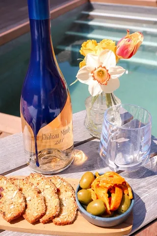 a very nice looking living room with dining room and wooden floor