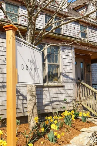a front view of a house with a iron gate
