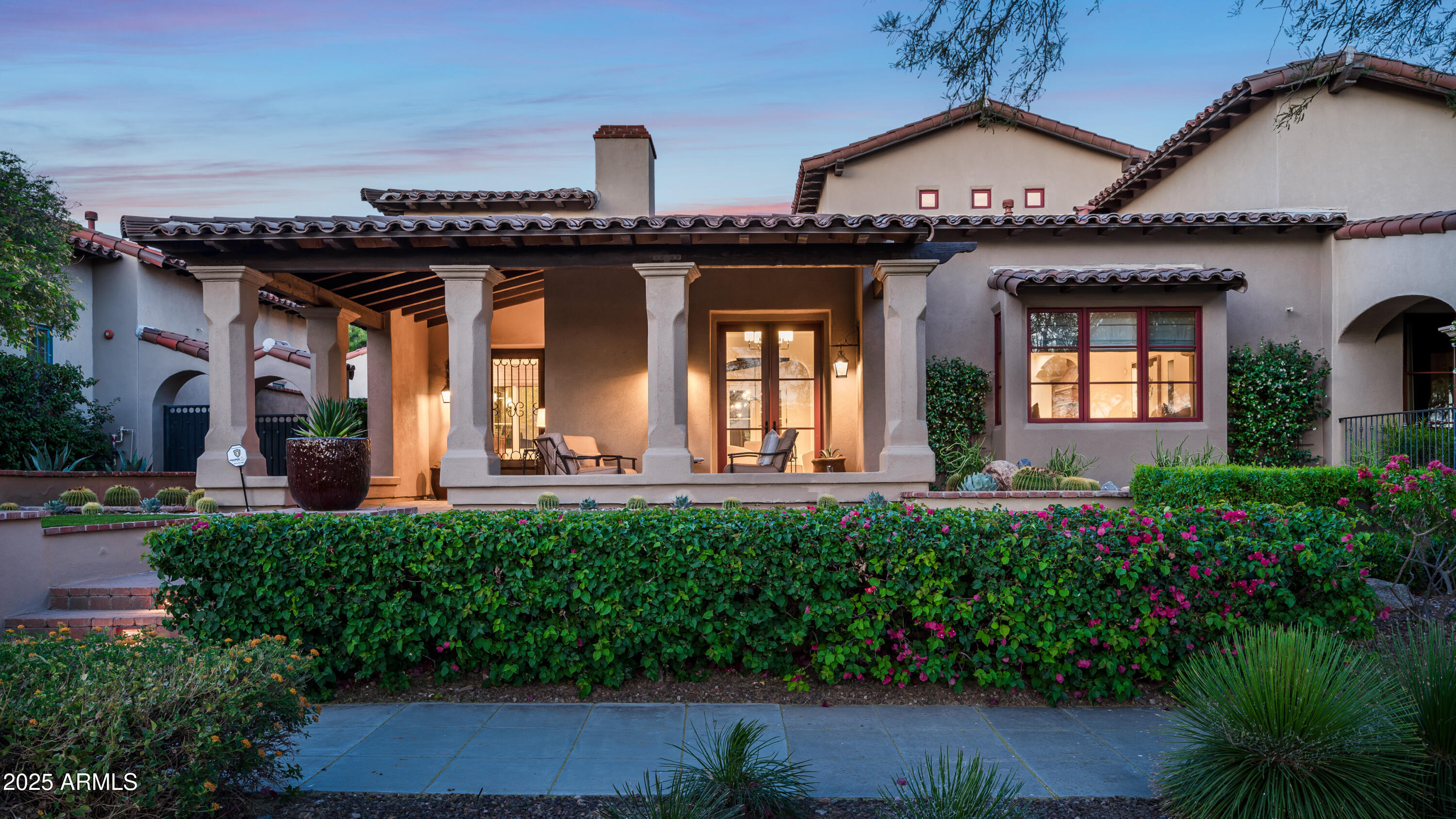 20263 North 102nd Place Scottsdale, AZ 85255 - Photo 2 of 58 a front view of a house with garden